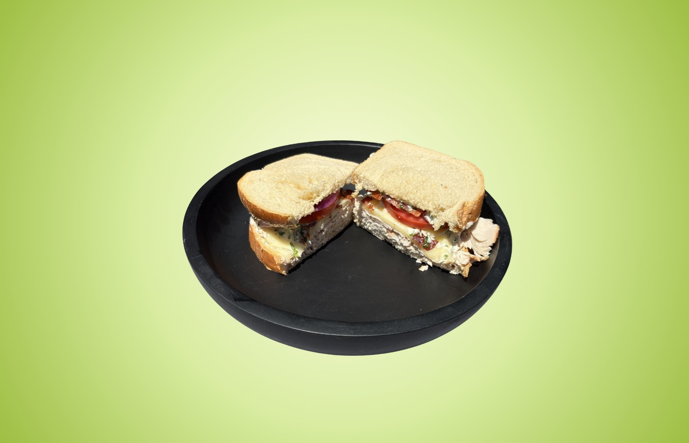 The Gobbler sandwich with turkey, applewood smoked bacon, provolone, tomato, onions, and cilantro mayo