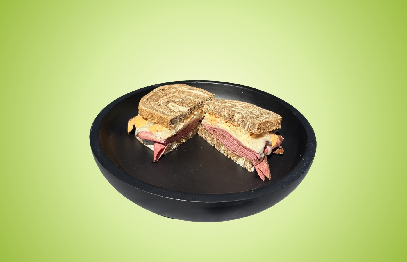 The Pastrami Reuben sandwich with hot pastrami, sauerkraut, Swiss cheese, and spicy Thousand Island on toasted marbled rye