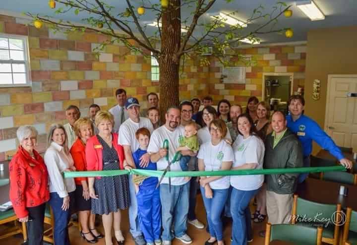 Inside the original Green Apple dining room with the community gathered