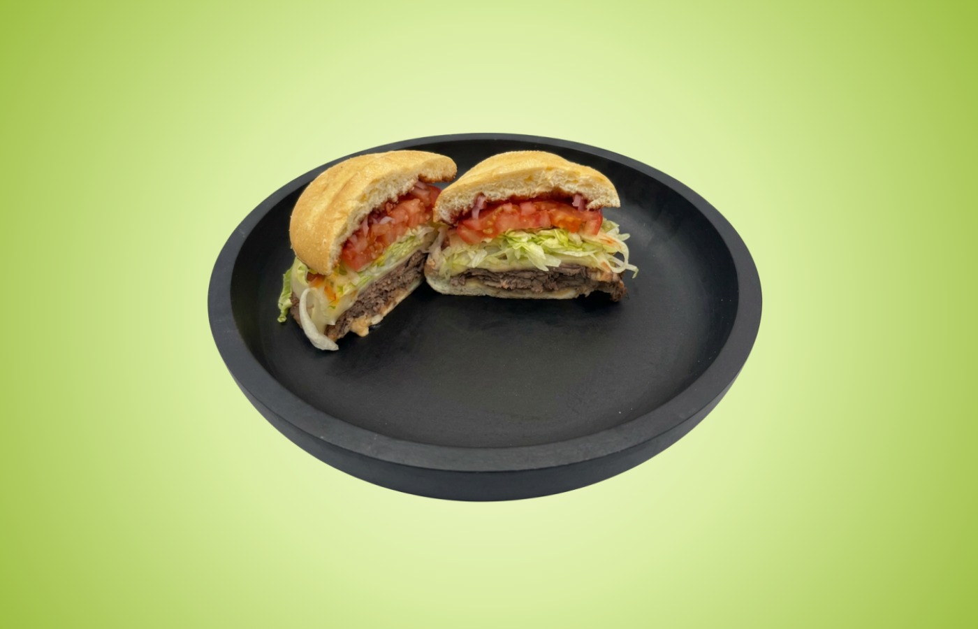 Uncle Victor’s Sassy Roast Beef sandwich with roast beef, cheese, lettuce, tomato, onions, and spicy sauce on a toasted Kaiser roll